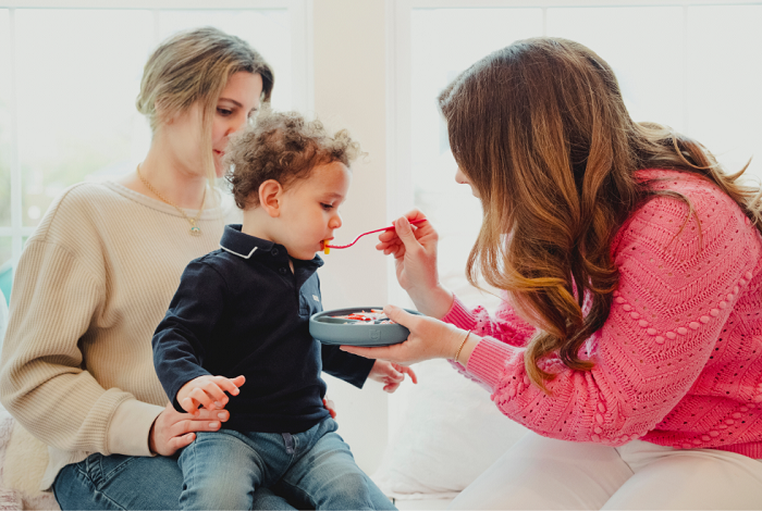 Durable silicone TalkTools Magenta Spoon for oral awareness and speech development