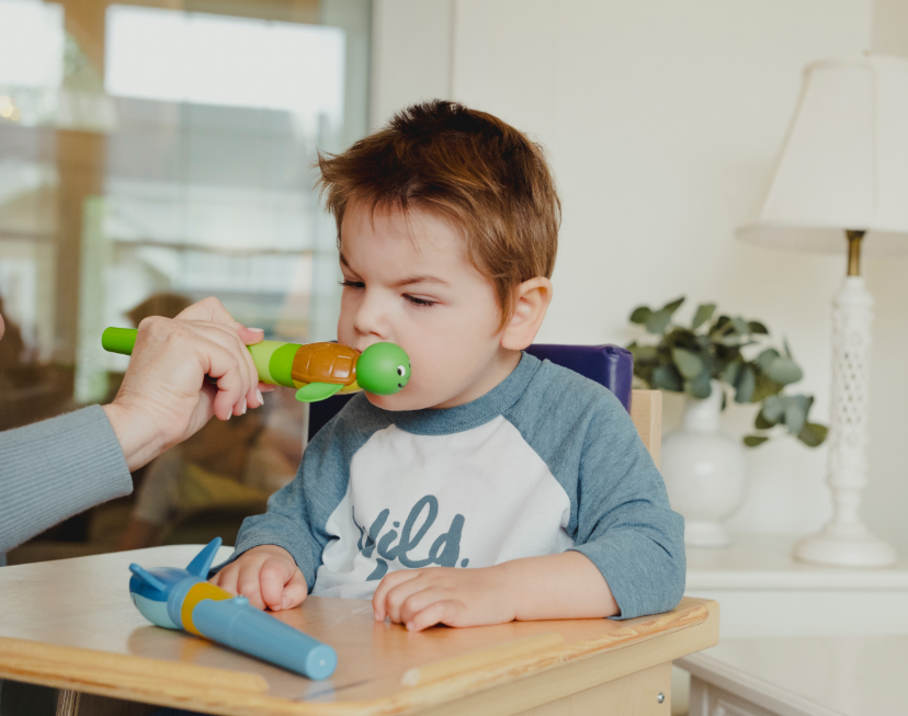 Child using TalkTools Jiggler Shark and Turtle for speech therapy and oral motor stimulation