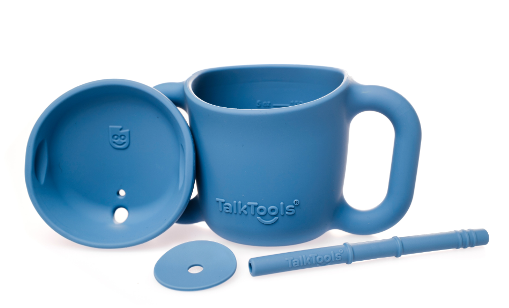 Toddler using a straw sippy cup for safe drinking