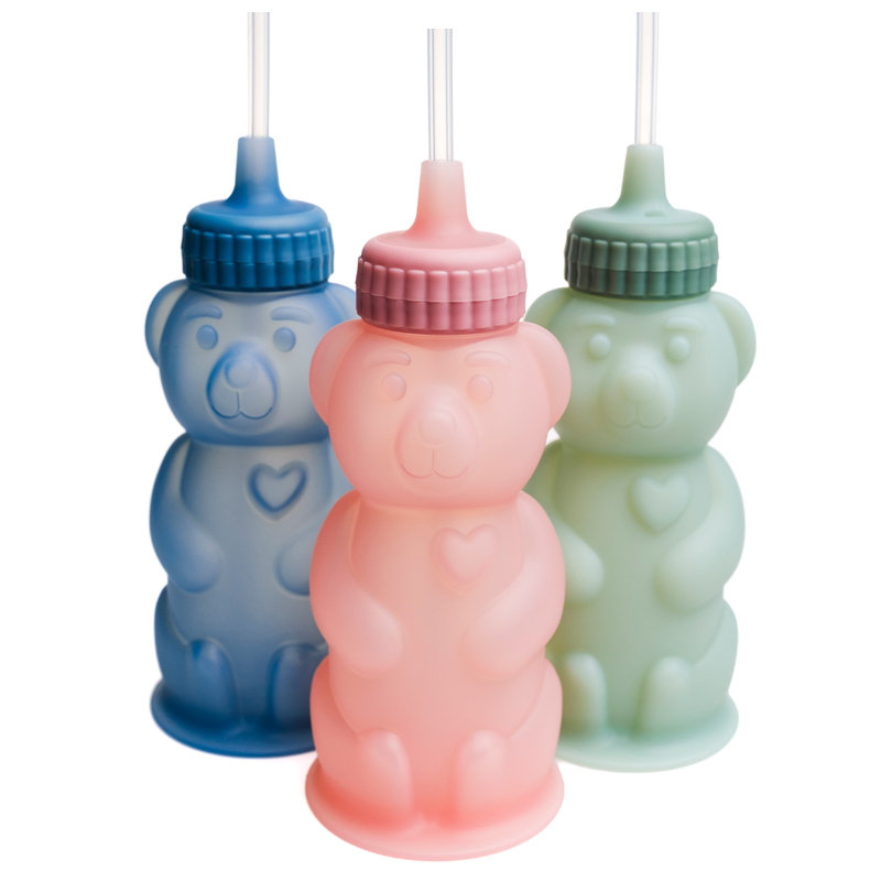 TalkTools Honey Bear silicone straw cup with bear-shaped design and attached straw, used for developing oral-motor skills and supporting independent drinking in children.
